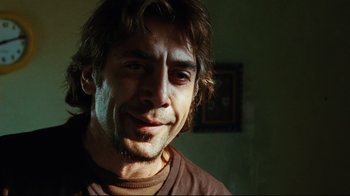 Movie still from “Biutiful” (2010), directed by Alejandro G. Iñárritu – A person wearing a brown t - shirt; Close Up shot, Low angle