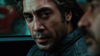 Movie still from “Biutiful” (2010), directed by Alejandro G. Iñárritu – A person wearing a leather jacket; Close Up shot, Over the shoulder angle
