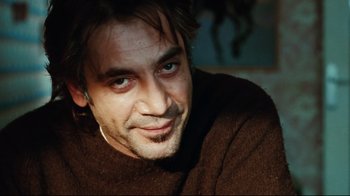 Movie still from “Biutiful” (2010), directed by Alejandro G. Iñárritu – A person wearing a brown sweater; Close Up shot, Over the shoulder angle