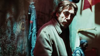 Movie still from “Biutiful” (2010), directed by Alejandro G. Iñárritu – A person wearing a jacket; Medium shot, Over the shoulder angle