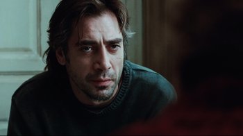 Movie still from “Biutiful” (2010), directed by Alejandro G. Iñárritu – A person sitting in a room; Close Up shot, Over the shoulder angle