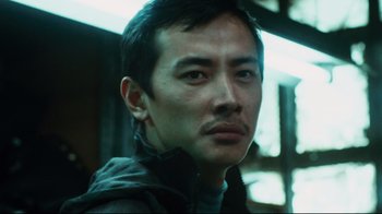 Movie still from “Biutiful” (2010), directed by Alejandro G. Iñárritu – A person wearing a jacket; Close Up shot, Low angle