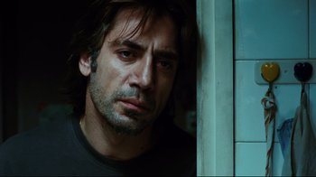 Movie still from “Biutiful” (2010), directed by Alejandro G. Iñárritu – A person with long dark hair; Close Up shot, Low angle