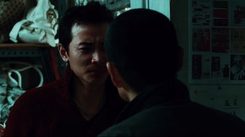 Movie still from “Biutiful” (2010), directed by Alejandro G. Iñárritu – Two men are looking at one another in a mirror; Close Up shot, Over the shoulder angle