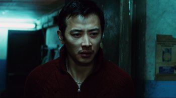 Movie still from “Biutiful” (2010), directed by Alejandro G. Iñárritu – A person wearing a jacket; Close Up shot, Low angle