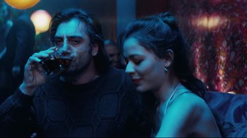 Movie still from “Biutiful” (2010), directed by Alejandro G. Iñárritu – A man and a woman standing next to each other; Medium shot, Over the shoulder angle
