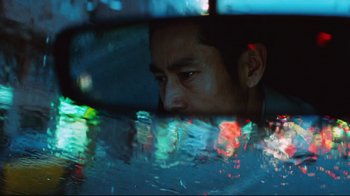 Movie still from “Biutiful” (2010), directed by Alejandro G. Iñárritu – A person in a car; Extreme Close Up shot, Low angle