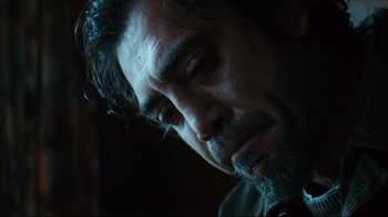 Movie still from “Biutiful” (2010), directed by Alejandro G. Iñárritu – A person with a beard; Close Up shot, Over the shoulder angle