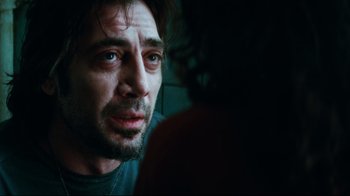 Movie still from “Biutiful” (2010), directed by Alejandro G. Iñárritu – A person looking at the camera; Close Up shot, Over the shoulder angle