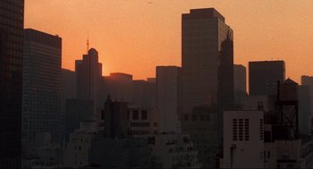 Movie still from “Black Caesar” (1973), directed by Larry Cohen – The sun is setting over a large city; Extreme Wide shot, High angle