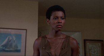 Movie still from “Black Caesar” (1973), directed by Larry Cohen – A woman that is standing in a room; Close Up shot, Low angle