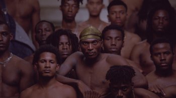 Movie still from “Black Is King” (2020), directed by Julian Klincewicz – A group of men standing next to each other; Extreme Wide shot, High angle