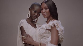 Movie still from “Black Is King” (2020), directed by Julian Klincewicz – Two beautiful women posing for a picture together; Close Up shot, Low angle