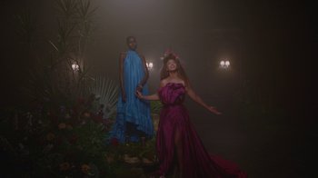 Movie still from “Black Is King” (2020), directed by Julian Klincewicz – Two women are standing in a dark room; Extreme Wide shot, Low angle