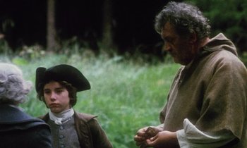 Movie still from “Black Jack” (1979), directed by Ken Loach – A man and a young boy standing next to each other in a field; Medium shot, Over the shoulder angle
