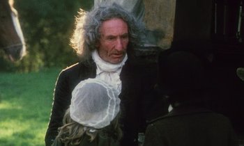 Movie still from “Black Jack” (1979), directed by Ken Loach – An old man with a long hair and a white wig; Medium shot, Over the shoulder angle