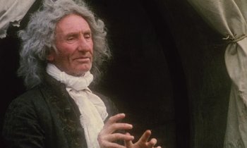 Movie still from “Black Jack” (1979), directed by Ken Loach – An older man wearing a wig and a black jacket; Close Up shot, Low angle