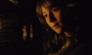 Movie still from “Black Jack” (1979), directed by Ken Loach – A person in a dark room; Close Up shot, Over the shoulder angle