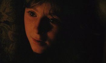 Movie still from “Black Jack” (1979), directed by Ken Loach – A person's face in the dark; Close Up shot, High angle