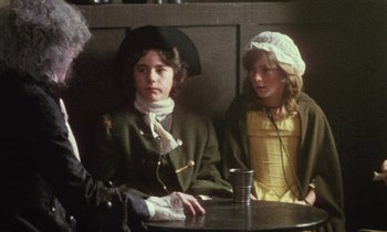 Movie still from “Black Jack” (1979), directed by Ken Loach – Two people sitting at a table with a cup of coffee; Medium shot, Over the shoulder angle