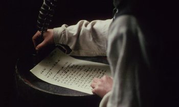 Movie still from “Black Jack” (1979), directed by Ken Loach – A person holding a sheet of paper in front of a phone; Extreme Close Up shot, High angle