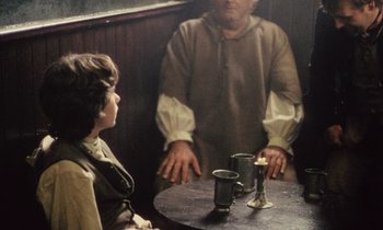 Movie still from “Black Jack” (1979), directed by Ken Loach – A man and a woman sitting in front of a table; Medium shot, Over the shoulder angle