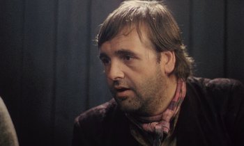 Movie still from “Black Jack” (1979), directed by Ken Loach – A person wearing a jacket; Close Up shot, Over the shoulder angle