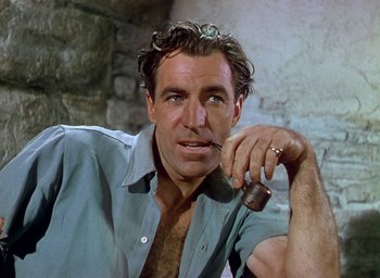 Movie still from “Black Narcissus” (1947), directed by Emeric Pressburger – A person holding a pipe in his mouth; Close Up shot, Low angle