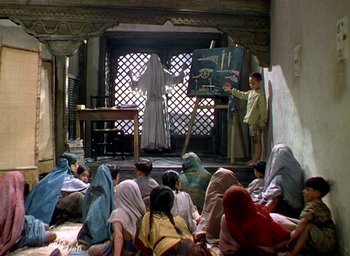 Movie still from “Black Narcissus” (1947), directed by Emeric Pressburger – A group of people sitting in a room; Wide shot, High angle