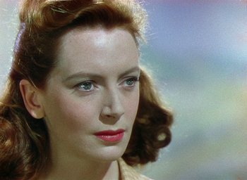 Movie still from “Black Narcissus” (1947), directed by Emeric Pressburger – A person with a red lipstick; Close Up shot, Over the shoulder angle
