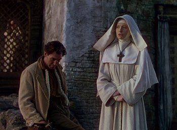 Movie still from “Black Narcissus” (1947), directed by Emeric Pressburger – A man and a woman dressed as a nun; Medium shot, Low angle