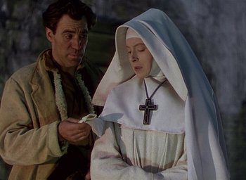 Movie still from “Black Narcissus” (1947), directed by Emeric Pressburger – A man and a woman dressed as a nun; Medium shot, Low angle