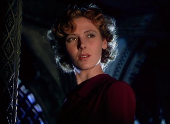 Movie still from “Black Narcissus” (1947), directed by Emeric Pressburger – A person with curly hair; Close Up shot, Low angle