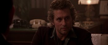 Movie still from “Black Rain” (1989), directed by Ridley Scott – A person wearing a suit and tie; Close Up shot, Over the shoulder angle