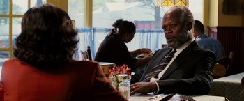 Movie still from “Black Snake Moan” (2006), directed by Craig Brewer – A group of people sitting at a table eating food; Close Up shot, Over the shoulder angle
