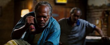 Movie still from “Black Snake Moan” (2006), directed by Craig Brewer – An older man is sitting down and talking on the phone; Close Up shot, Over the shoulder angle