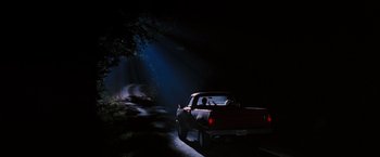 Movie still from “Black Snake Moan” (2006), directed by Craig Brewer – A truck driving down a dark road at night; Extreme Wide shot, Low angle
