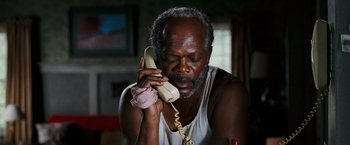 Movie still from “Black Snake Moan” (2006), directed by Craig Brewer – An older man is talking on a phone; Close Up shot, High angle