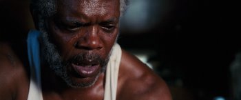 Movie still from “Black Snake Moan” (2006), directed by Craig Brewer – An older man with a towel around his neck; Close Up shot, Low angle