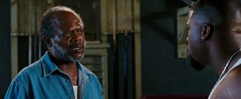 Movie still from “Black Snake Moan” (2006), directed by Craig Brewer – An older man standing in front of a mirror; Close Up shot, Over the shoulder angle