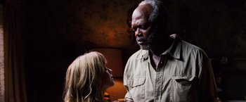 Movie still from “Black Snake Moan” (2006), directed by Craig Brewer – An older man and a young woman looking at each other; Close Up shot, Over the shoulder angle