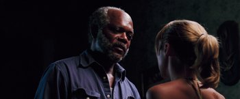 Movie still from “Black Snake Moan” (2006), directed by Craig Brewer – An older man and a young woman standing next to each other; Close Up shot, Over the shoulder angle