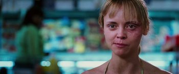 Movie still from “Black Snake Moan” (2006), directed by Craig Brewer – A person wearing a necklace; Close Up shot, Over the shoulder angle