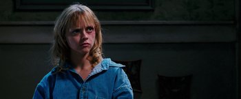 Movie still from “Black Snake Moan” (2006), directed by Craig Brewer – A woman with a bruised face looking into the distance; Close Up shot, Low angle