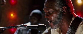 Movie still from “Black Snake Moan” (2006), directed by Craig Brewer – A person singing on a microphone; Close Up shot, Low angle