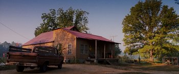 Movie still from “Black Snake Moan” (2006), directed by Craig Brewer – An old truck parked in front of a house; Extreme Wide shot, Low angle