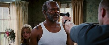 Movie still from “Black Snake Moan” (2006), directed by Craig Brewer – An older man is being examined by a doctor; Close Up shot, Over the shoulder angle