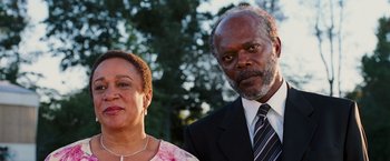 Movie still from “Black Snake Moan” (2006), directed by Craig Brewer – An older man and a younger woman posing for a picture; Close Up shot, Low angle