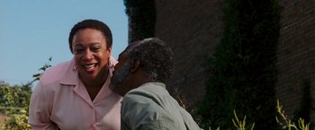 Movie still from “Black Snake Moan” (2006), directed by Craig Brewer – An older man kissing a younger woman's cheek; Close Up shot, Over the shoulder angle