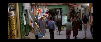 Movie still from “Black Sunday” (1977), directed by John Frankenheimer – A group of people walking down a street; Wide shot, High angle